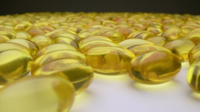 4k motorized moving shot of fish oil capsules