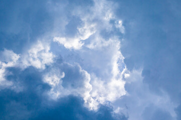 Naklejka na ściany i meble Blue sky with contrasting white clouds