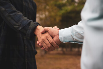 People shake hand greeting teamwork partnership friendship outdoor community