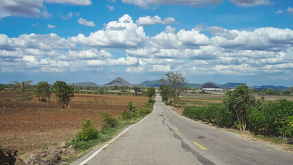  country road under blue sky 