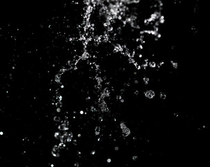 jet of water with splashes on a black background