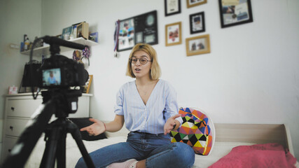 Female blogger making video blog at home