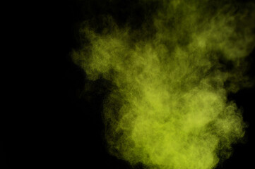 Light green powder explosion on black background. Colored powder cloud. Colorful dust explode. Paint  Holi.