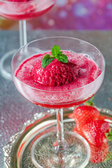 Festive vodka and prosecco cocktail with strawberry sorbet
