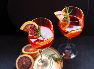 Two glasses with aperol spritz drink with slice of blood orange, tasty alcohol cocktail, view from above