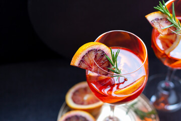 Two glasses of aperol spritz drink with slice of blood orange, tasty alcohol cocktail, view from above