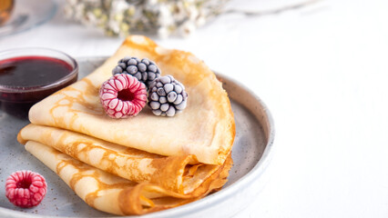 Pancakes with berries and  fruit sauce. Breakfast concept. Text space