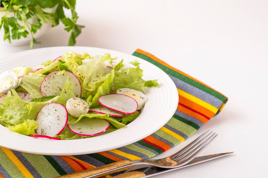 Vegetable salad with radish, quaill eggs and lettuce. Diet food concept