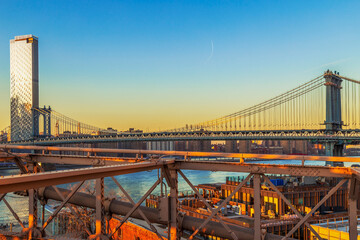 View of Manhattan bridge from Brooklyn bridge in afternoon light