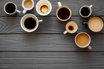 Many cups of coffee on wooden table top-down copy space