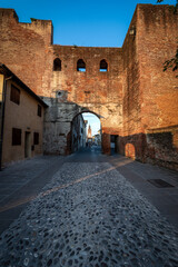 Fototapeta na wymiar Ancient medieval walls of Castelfranco Veneto with the Porta del Musile (Musile door) entrance of the old town, west side (XII-XIII century). Treviso province, Veneto, Italy, Europe