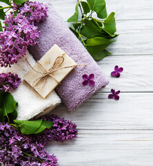 Spa towels and soap and lolac flowers
