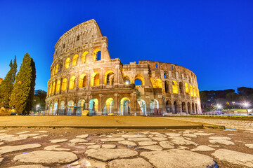 Fototapeta na wymiar Illuminated Colosseum at Dusk, Rome