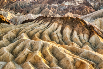 Badlands view from Zabriskie Point in Death Valley National Park at Sunset