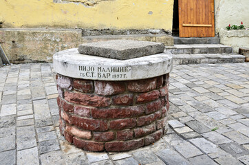 Closed well or pedestal from a monument on one of the streets in the historical part of the city Old Bar in Montenegro