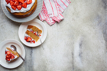 Flat lay of berry cake, copy space, top view. Vegan Strawberry Cake with Coconut Cream. Plant based dessert concept.