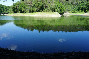 Lake in the forest, reflection in the water, beautiful scenery