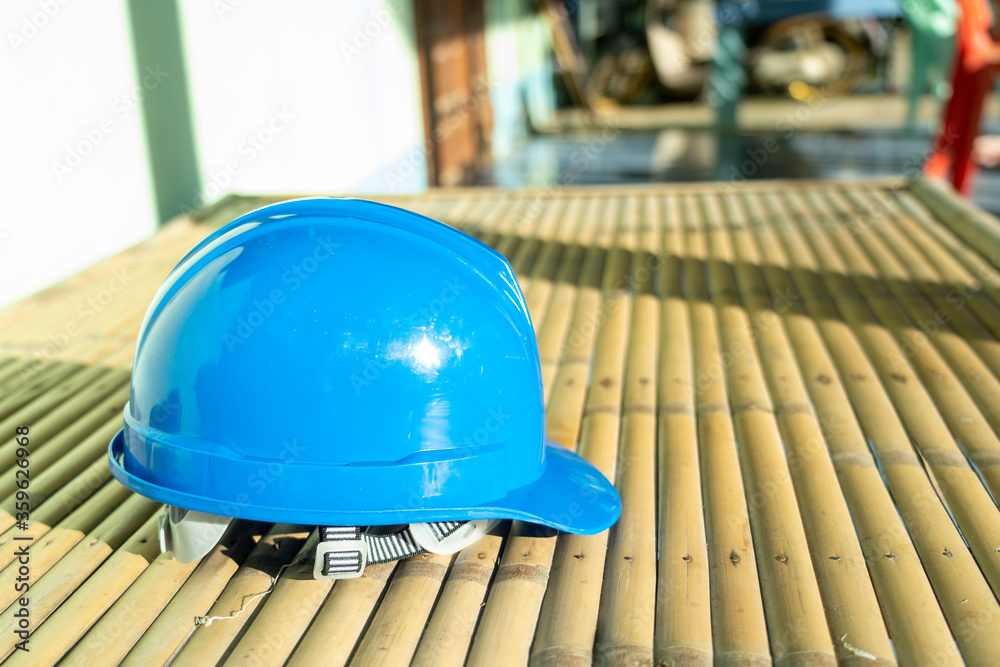 Wall mural blue hard safety helmet hat for safety workman as engineer or worker.