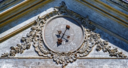 old clock on castle wall