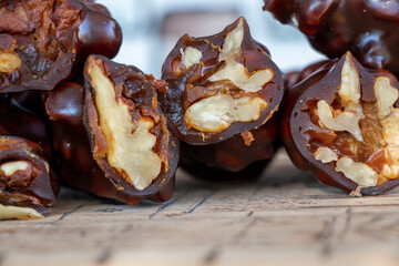 Turkish traditional snack dessert, walnut sucuk. It is made with grape molasses and walnuts. Close-up view.