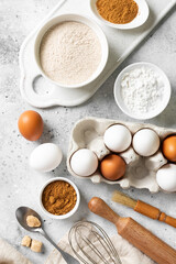 Ingredients for baking on a culinary background. Eggs, flour, cinnamon, sugar, soda on the kitchen table. Concept of preparation for baking	