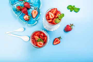 Delicious Italian dessert Panna Cotta with strawberry coulis. Milk dessert with berries. banner menu recipe place for text