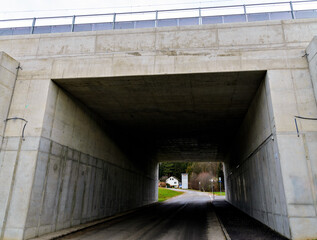 Concrete underpass below a railroad line