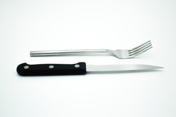 stainless fork and knife on white background