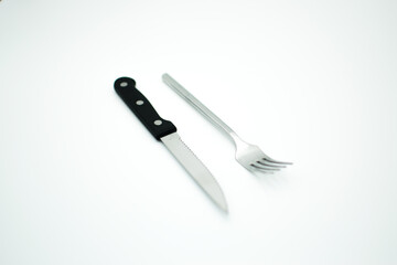 stainless fork and knife on white background