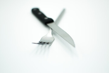stainless fork and knife on white background