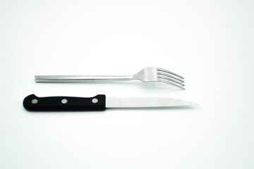 stainless fork and knife on white background