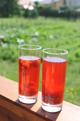 Traditional European non-alcoholic fruit beverage compote made from strawberries and rhubarb in summer