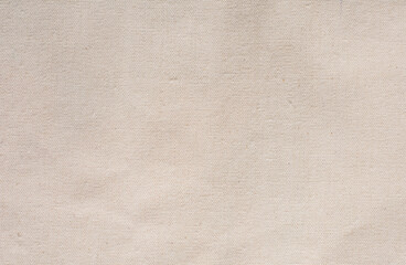 Fototapeta na wymiar Light beige fabric texture. Burlap. Light rough fabric background.