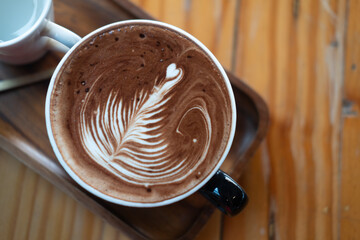 Delicious hot chocolate with froth art on top in cup