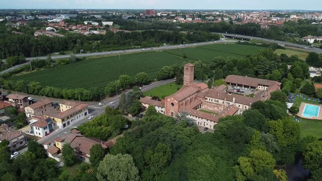 Aerial view of Pavia, Italy: San Lanfranco romanic church and city skyline on the background