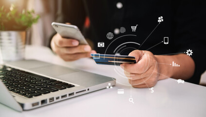 Businessman use credit card to shopping online in internet website shop with smartphone on work table in office.