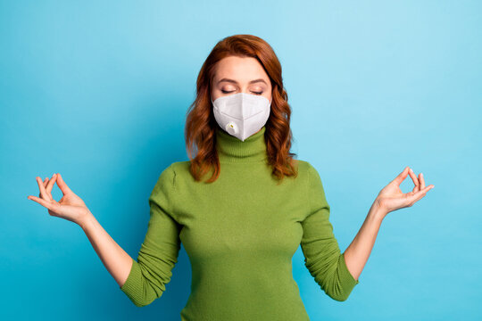 Close-up portrait of her she serene focused wavy-haired girl meditating wearing safety mask mers cov stay home prevention isolated bright vivid shine vibrant blue turquoise teal color background - Powered by Adobe