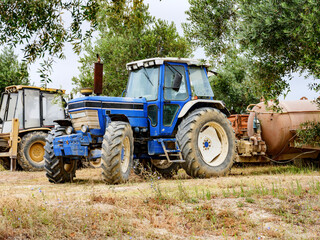 Naklejka premium Tractor on the farm for the maintenance of the vineyard