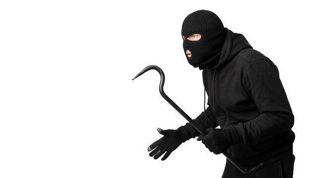 Thief wearing black mask and hoodie looking at copyspace