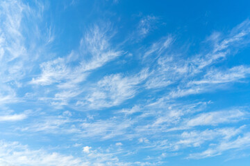 Naklejka na ściany i meble White clouds on blue sky. Abstract natural background. Atmospheric phenomenon.