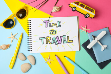 Composition with inscription Time to travel on multicolor background