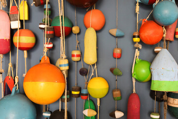  Many different retro old fishing floats on the wall
