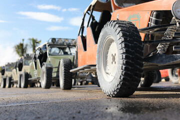 Fototapeta na wymiar Close up of tread tire 4x4 off road, Texture of dirty wheel pickup car. Adventure on countryside.