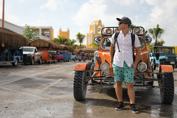 Man standing near buggy car in the port Costa Maya Mexico