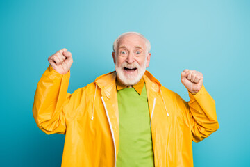 Portrait of his he nice cheerful cheery lucky grey-haired man wearing topcoat celebrating good luck...