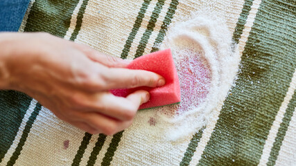 Hand with a sponge and salt