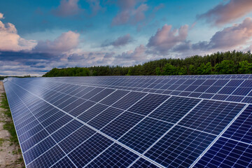 Beautiful view of the solar station on the field. Renewable green energy of the sun.