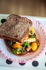 Healthy sandwiches with french fries, tomato cherries, and minty leaves.