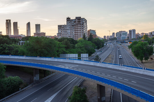 Cityscape from M30 bridge, at sunset during the confinement by covid-19, in Madrid, Spain, horizontal