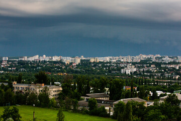 Fototapeta premium Chisinau, the capital city of the Republic of Moldova. Storm clouds over city. Cloud over the city at the sunset.